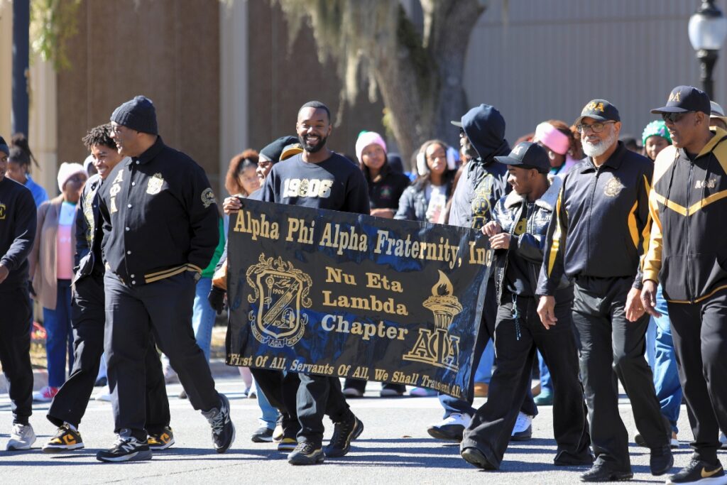 Alpha Phi Alpha gathers to march in the MLK Jr. Day Parade.