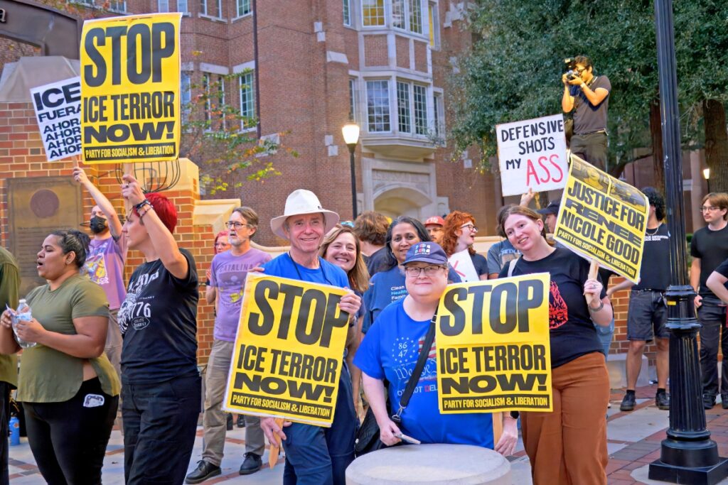 An anti-U.S. Immigration and Customs protest on NW 13th Street and University Avenue in Gainesville on Thursday. Photo by Chuck Ross