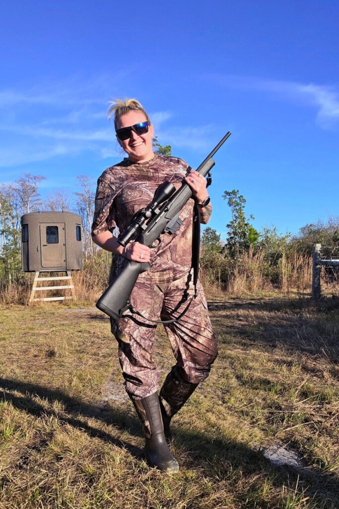 Ashlyn Croff, 33, poses with her gun while hunting for a Florida black bear Dec. 11, 2025. The Pensacola native was one of just 172 people to win a hunting permit during the first Florida bear hunt in a decade.