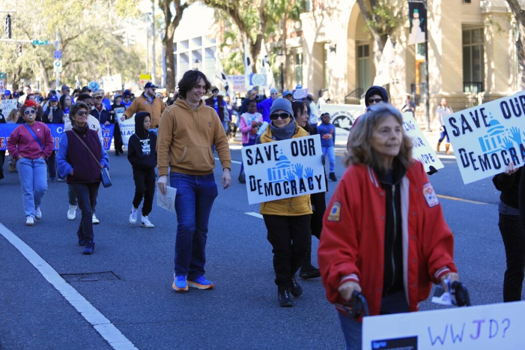 Attendees march in the MLK Jr. Parade.