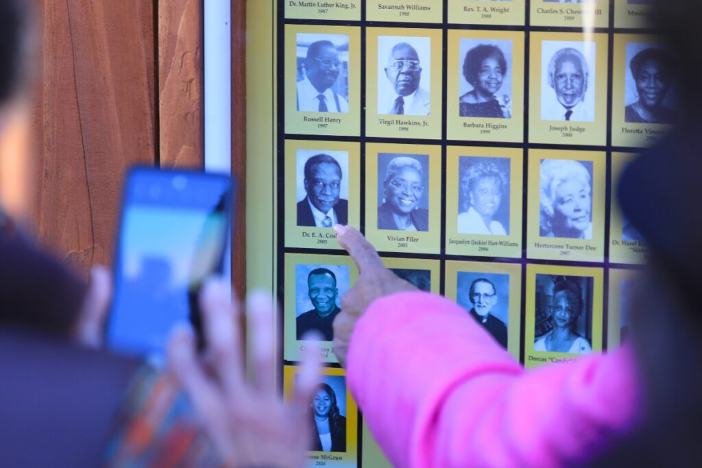 Attendees take photos of themselves with past Hall of Fame inductees.