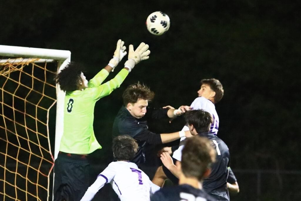 Buchholz goalkeeper Coby Taylor (0) goes for a save against Gainesville. Photo by C.J. Gish