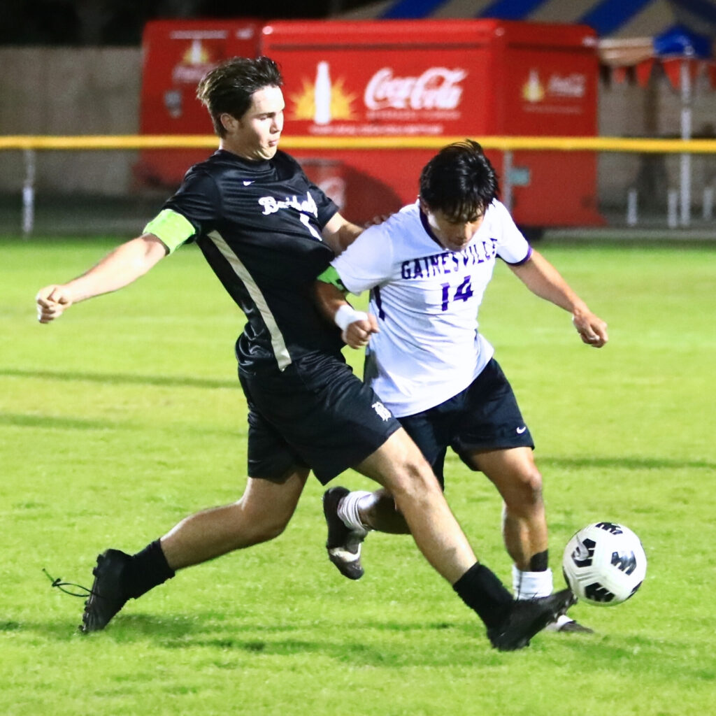 Buchholz's Dylan Fitzpatrick (1) and Gainesville's Calixto Zaldivar (14) battle for the ball. Photo by C.J. Gish