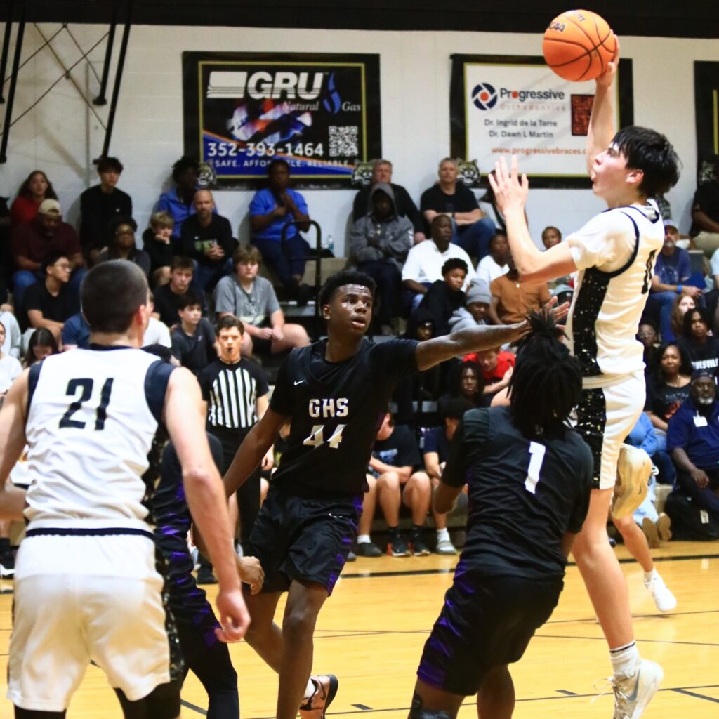 Buchholz's Jacob Bromirski (0) puts up a shot against Gainesville. Photo by C.J. Gish