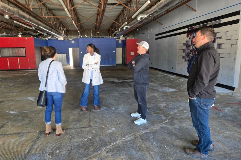 Contractors for design and construction walk through the new space. Courtesy Dream on Purpose