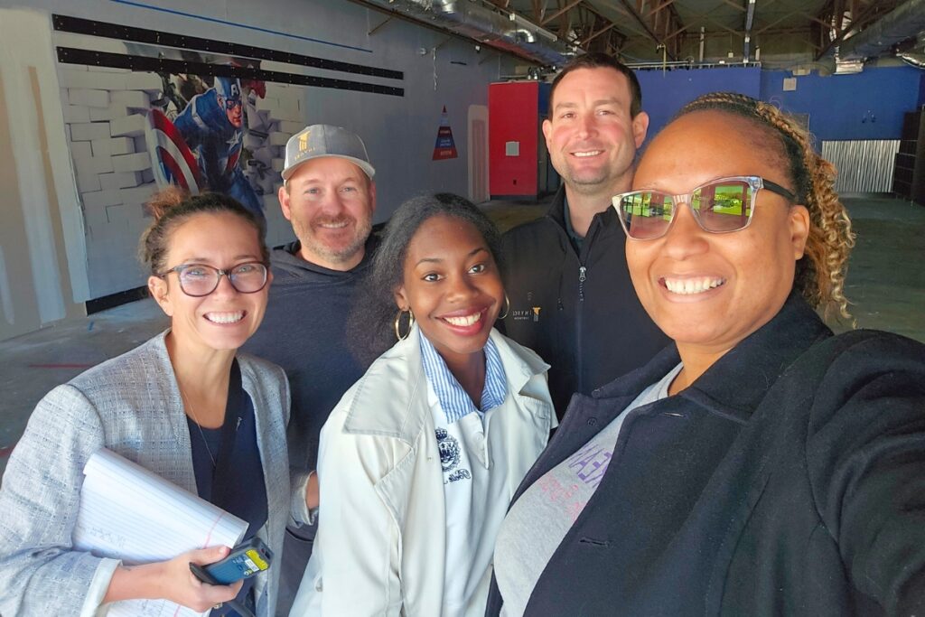 Dream on Purpose and its design and construction crew walk through the new space. Courtesy Dream on Purpose