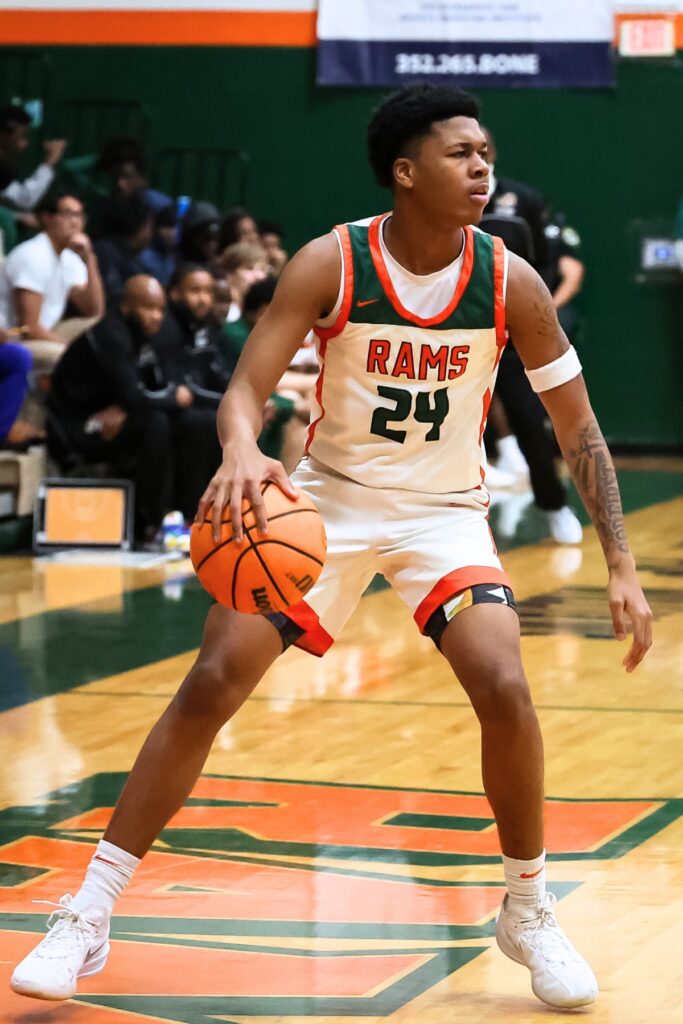 Eastside Raheem Littles (24) dribbles down court during the first half against Buchholz. Photo by Chris Watkins