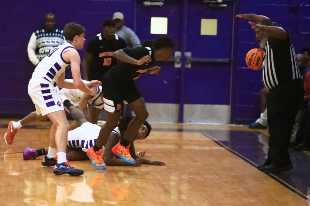 Gainesville and Hawthorne players watch a loose ball go out of bounds. Photo by C.J. Gish