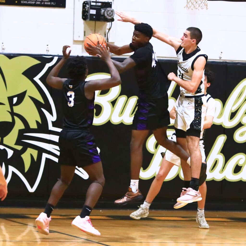 Gainesville's AJ Hall (44) grabs a rebound against Buchholz. Photo by C.J. Gish
