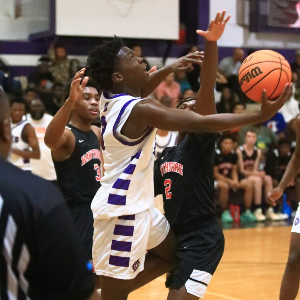 Gainesville's Corvaughn White (3) puts up a shot against Hawthorne. Photo by C.J. Gish