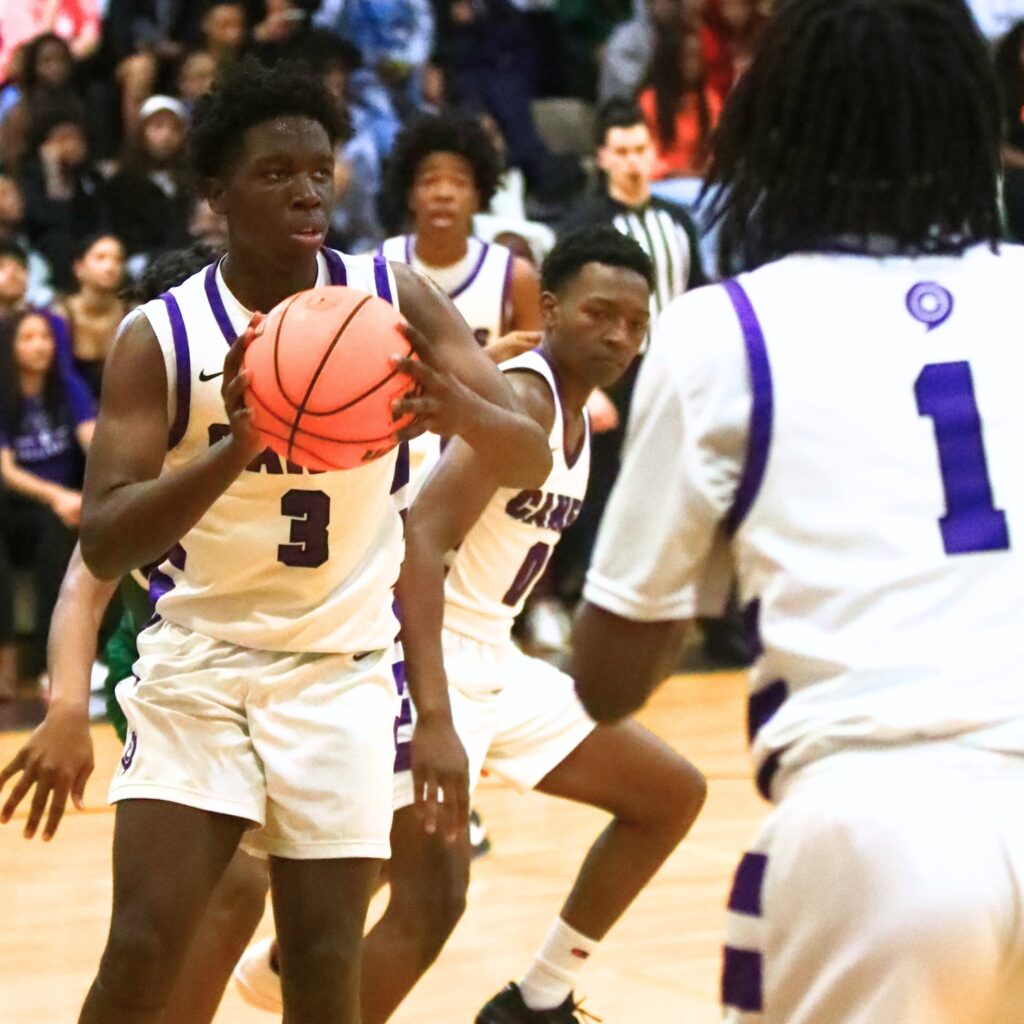 Gainesville's Corvaughn White (3) with a defensive rebound against Eastside. Photo by C.J. Gish