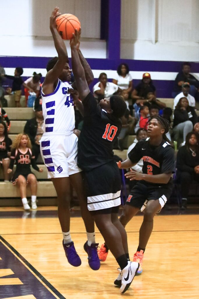 Hawthorne's Kyler Ingram (10) gets a hand on the ball against Gainesville's AJ Hall (44). Photo by C.J. Gish