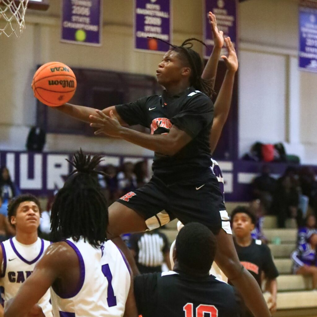 Hawthorne's Nathan Jennings (2) drives to the basket against Gainesville. Photo by C.J. Gish