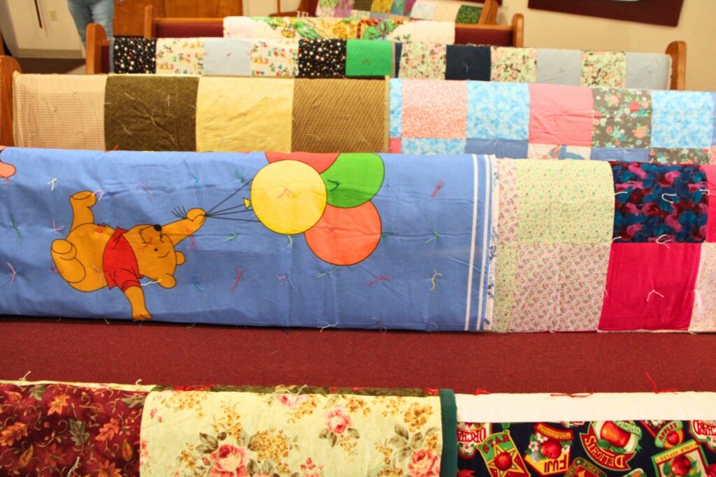 In 2025, over 803,000 quilts and care kits distributed by Lutheran World Relief, including ones made by The Knotty Ladies in Gainesville. Photo by Lillian Hamman