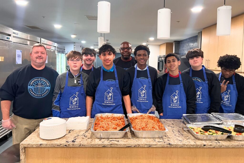 Members of the Gainesville Christian Community School middle school boys basketball helped prepare and serve a meal to residents at the Ronald McDonald House Charities of North Central Florida on Jan. 14. Photo by Nick Anschultz