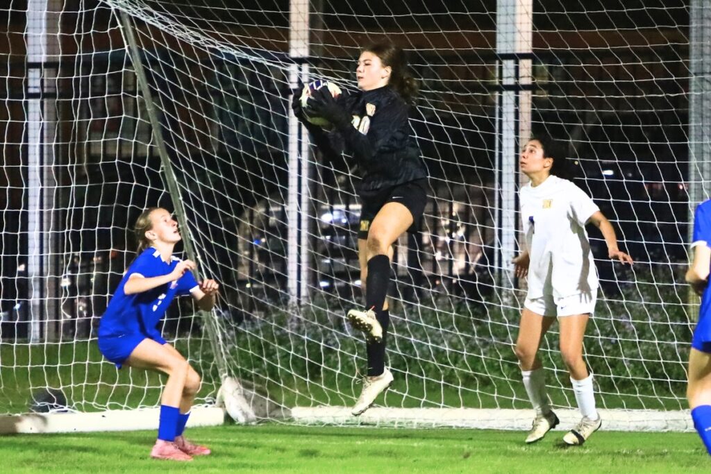 Newberry goal keeper Emma Ellenburg with a second-half save against P.K. Yonge. Photo by C.J. Gish