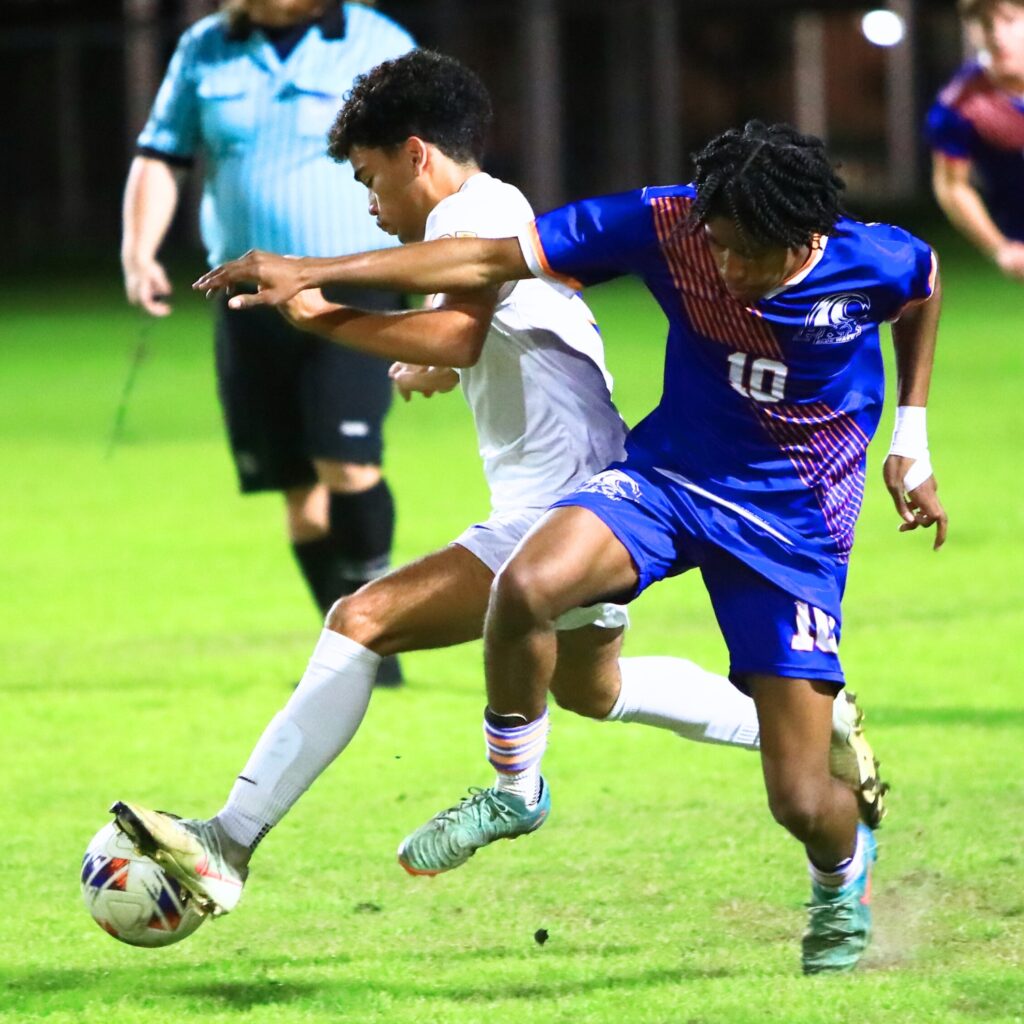 Newberry's Carson Hass (5) and P.K. Yonge's Davy Coleman (10) battle for the ball. Photo by C.J. Gish