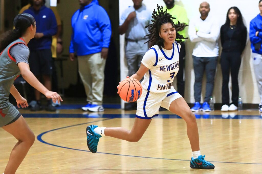 Newberry's Rihanna Chiever (3) brings the ball down the court against Williston. Photo by C.J. Gish