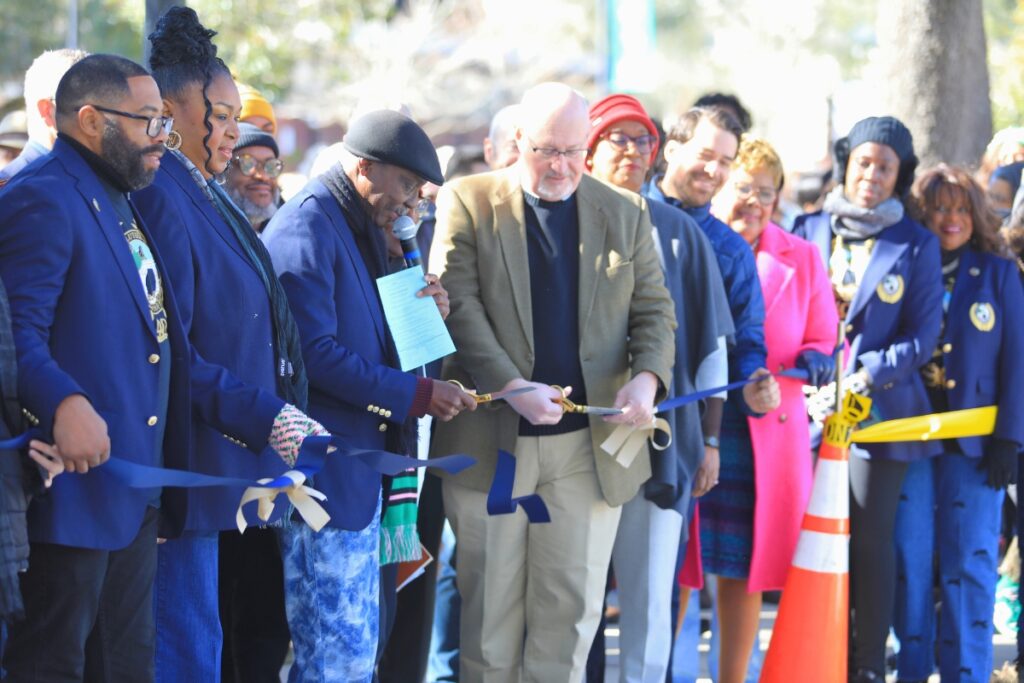 Officials from Gainesville and the Martin Luther King, Jr., Commission of Florida cut the ribbon on the newly renovated memorial gardens.