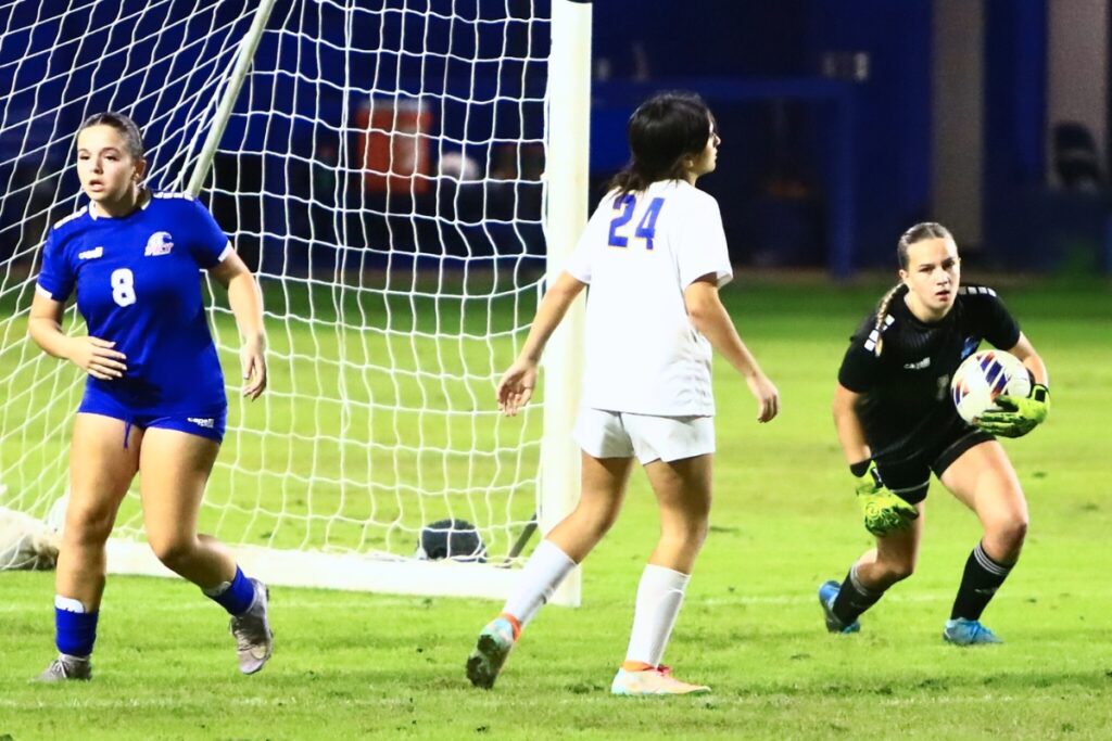 P.K. Yonge goal keeper Norah Pancoast (1) with a save against Newberry. Photo by C.J. Gish