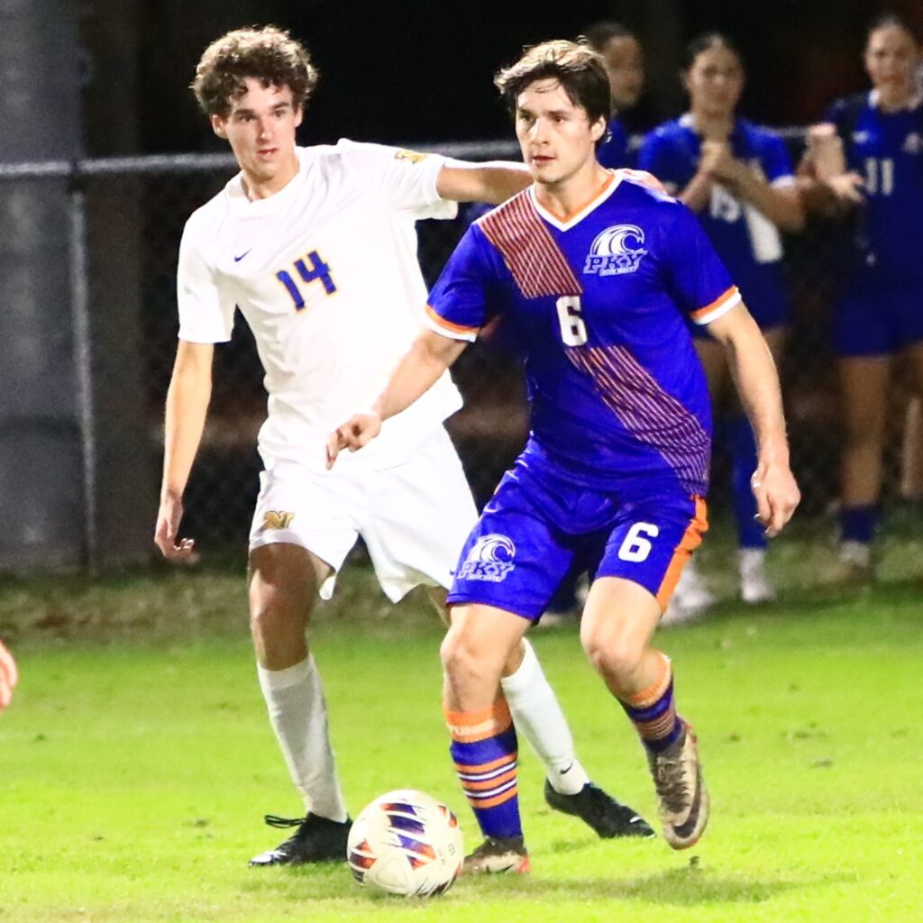 P.K. Yonge's David Demers (6) gets in front of Newberry's Lucas Nowels (14). Photo by C.J. Gish