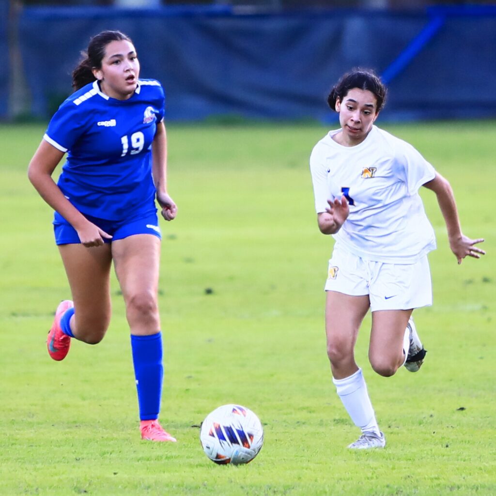 P.K. Yonge's Sofia Ochoa (19) and Newberry's Crystal Cabantac (1) go after the ball. Photo by C.J. Gish