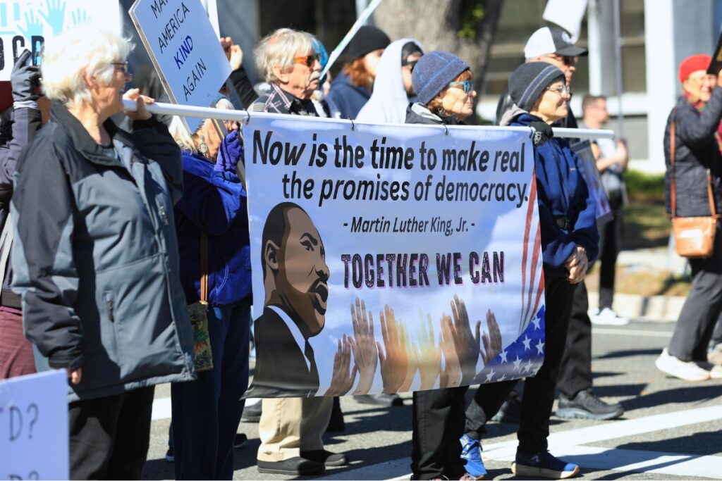 Parade attendees march on Monday.