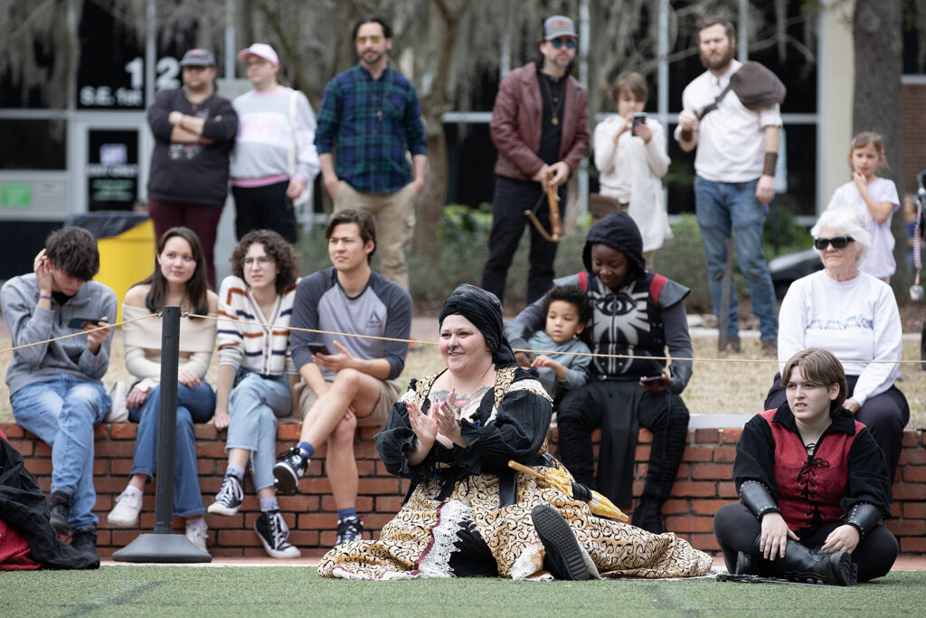Spectators follow the action unfolding during a Living Chessboard game. Depot Park will host this year’s Hoggetowne Medieval Faire, a free event.
