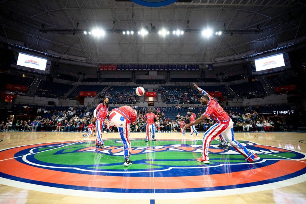 The Harlem Globetrotters performing their tricks during the "Magic Circle."