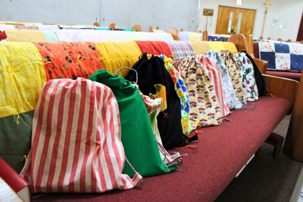 The Knotty Ladies sewed and filled over 20 drawstring school bags for Lutheran World Relief to distribute around the world. Photo by Lillian Hamman