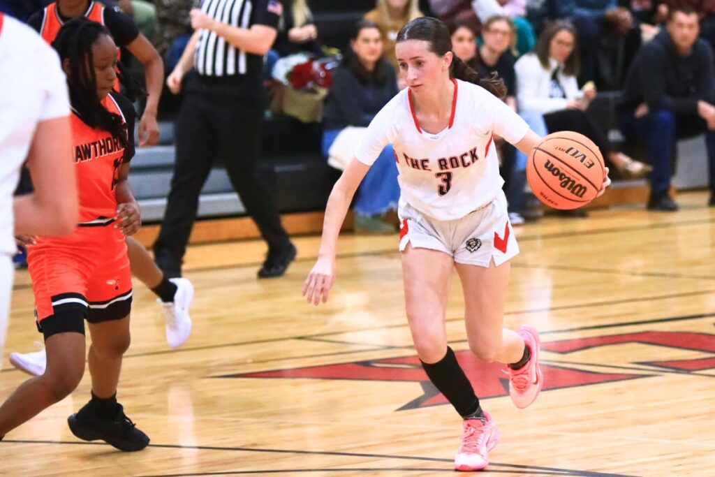 The Rock's Audrey Roberts (3) drives to the basket against Hawthorne. Photo by C.J. Gish