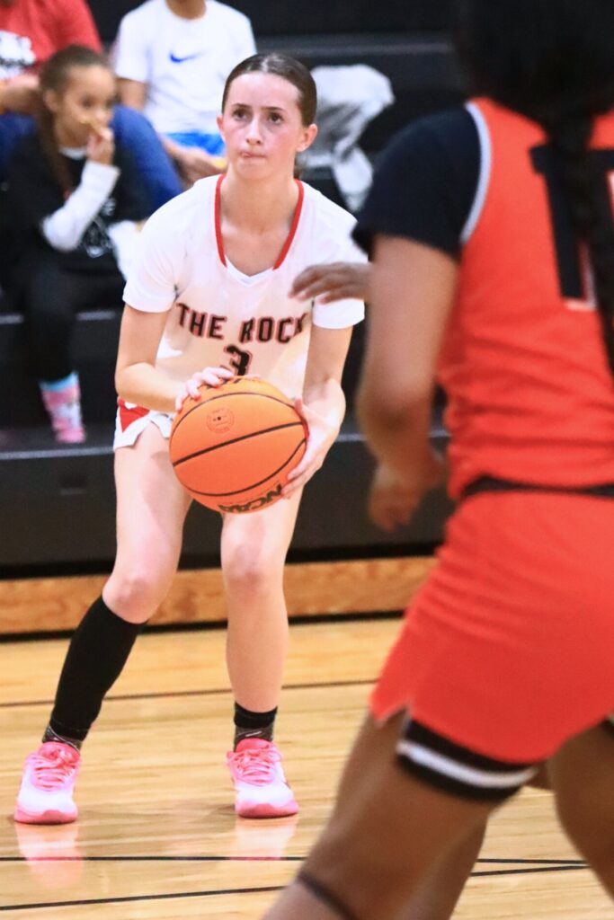 The Rock's Audrey Roberts (3) launches a 3-point shot against Hawthorne. Photo by C.J. Gish