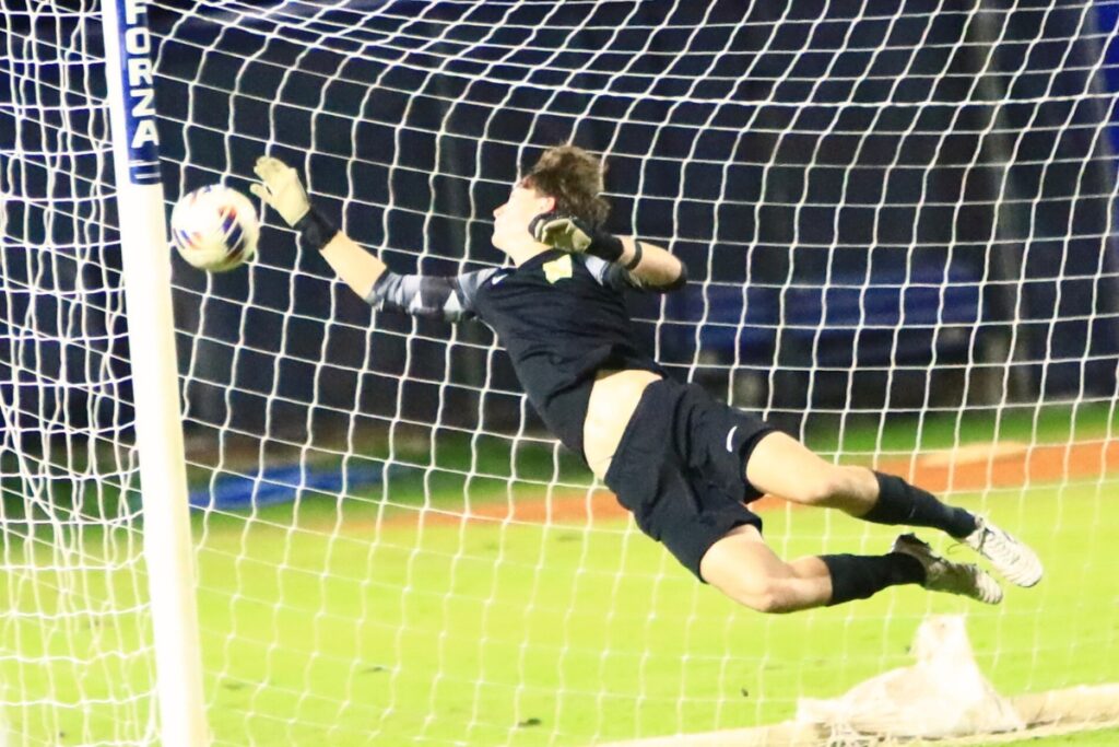 The ball gets past Newberry goal keeper Cayden Francis for P.K. Yonge's first score. Photo by C.J. Gish