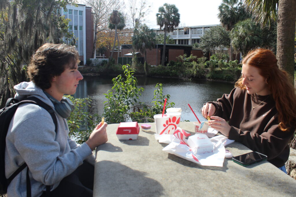 University of Florida students Lucas Wilder and Sophie Headrick eat lunch in between classes on Monday. Photo by Nick Anschultz
