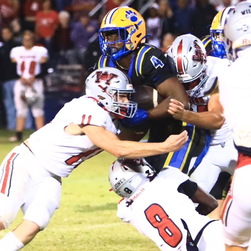 Williston's Danny Burchett (11) and Maverick Jones (8) were both named to the 2025 All Area small school defensive team. Photo by C.J. Gish
