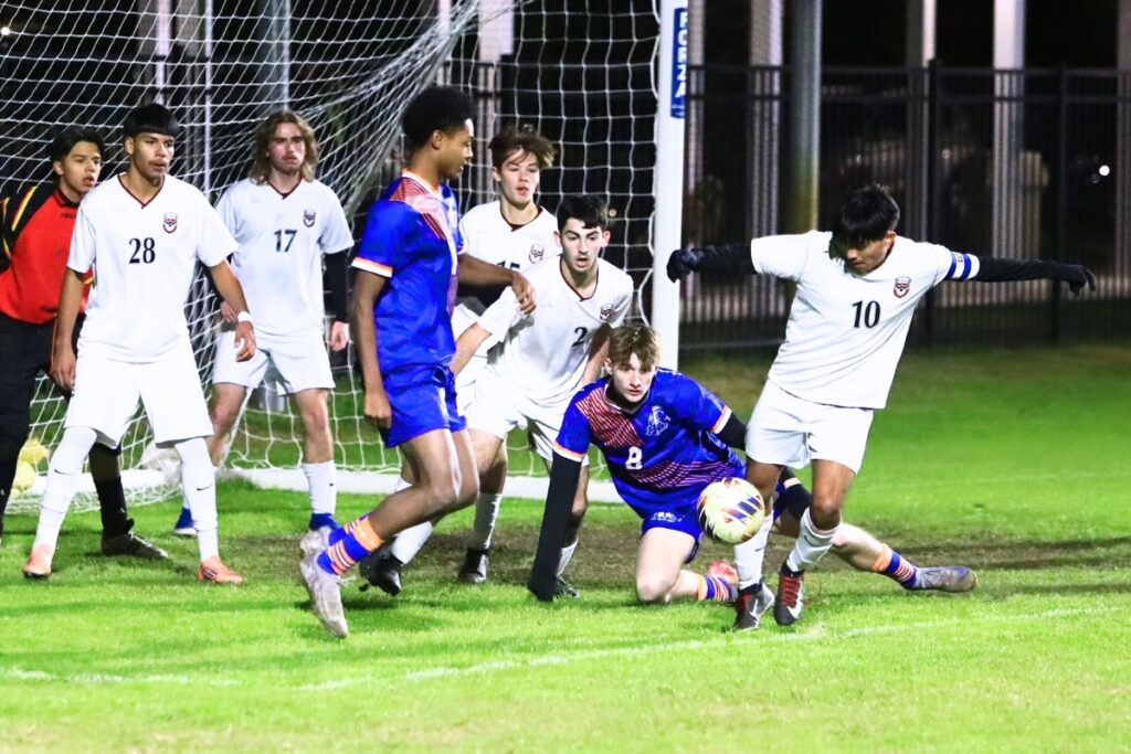 Williston's Miguel Gutierrez (10) clears the ball away from the goal against P.K. Yonge. Photo by C.J. Gish