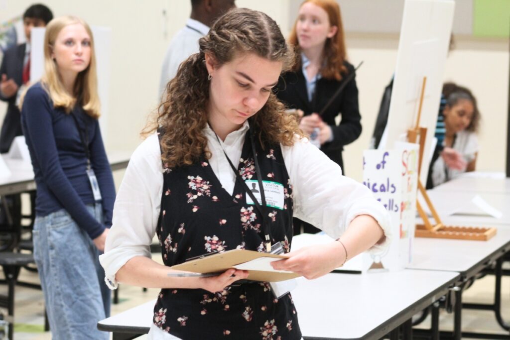 A judge tallies scores on Thursday morning. Photo by Nick Anschultz