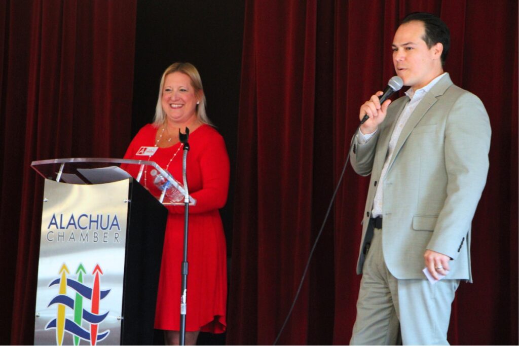 Alachua Chamber of Commerce President Shelley Vickers (left) and Alachua City Manager Rodolfo Valladares address members during the February luncheon. Photo by Lillian Hamman