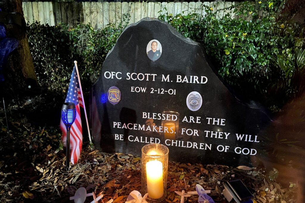 An engraved memorial marks the spot and lists Officer Scott Baird’s end-of-watch date. Photo by Seth Johnson