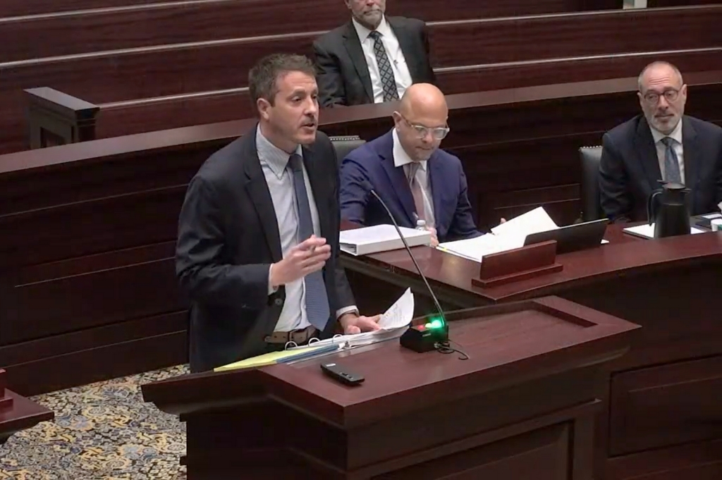 Attorney Joe Eagleton stands at a podium at the Florida First District Court of Appeal.