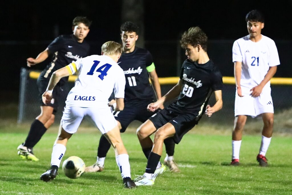 Buchholz's Carlos Cadet (11) and Finn Richards (20) go after the ball against South Lake (Groveland) in the Class 6A-Region 1 Semifinals. Photo by C.J. Gish