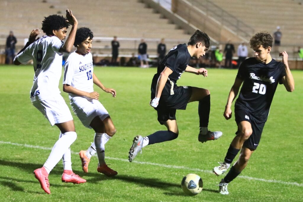 Buchholz's Christian McDaniel (12) and Finn Richards (20) go after the ball against South Lake (Groveland) in the Class 6A-Region 1 Semifinals. Photo by C.J. Gish