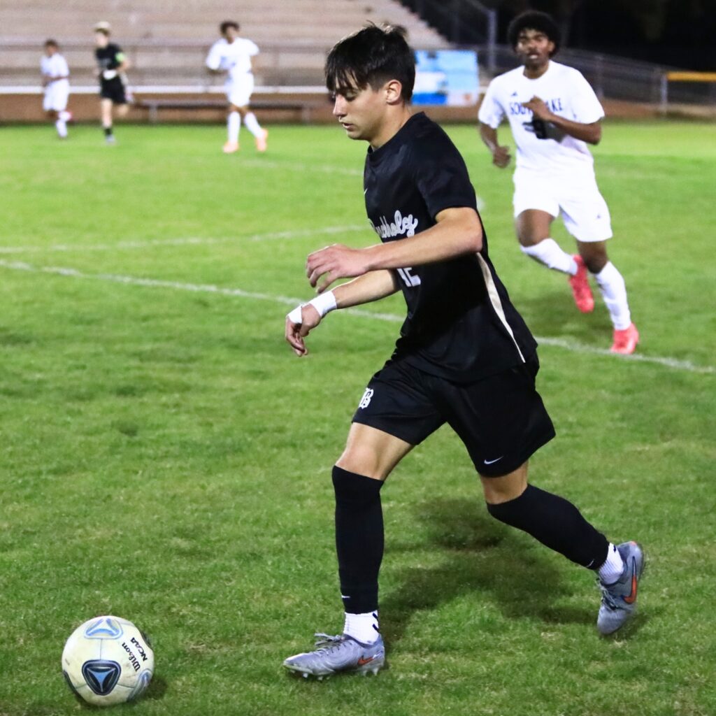 Buchholz's Christian McDaniel (12) dribbles the ball downfield against South Lake (Groveland) in the Class 6A-Region 1 Semifinals. Photo by C.J. Gish
