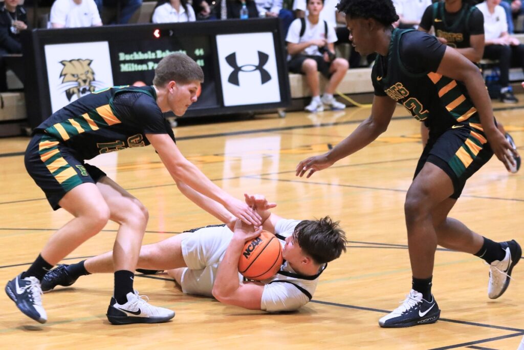 Buchholz's Evan Walker (22) calls a time out during a scramble for the ball against Forest (Ocala) in the Class 6A-Region 1 semifinal. Photo by Seth Johnson