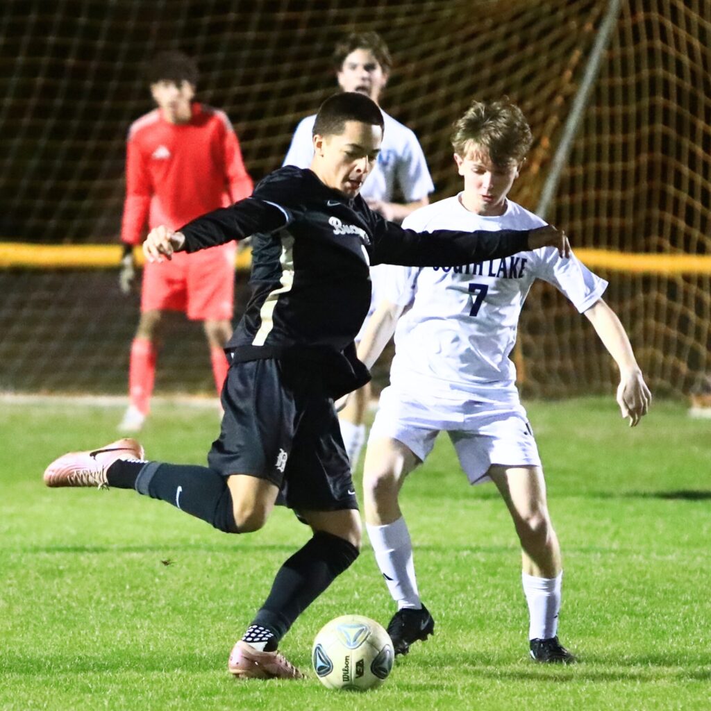 Buchholz's Isaac Covo (5) passes the ball against South Lake (Groveland) in the Class 6A-Region 1 Semifinals. Photo by C.J. Gish