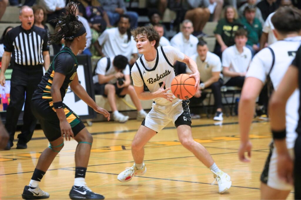 Buchholz's Lucas Bhatia (5) brings the ball up the court against Forest (Ocala) in the Class 6A-Region 1 semifinal. Photo by Seth Johnson