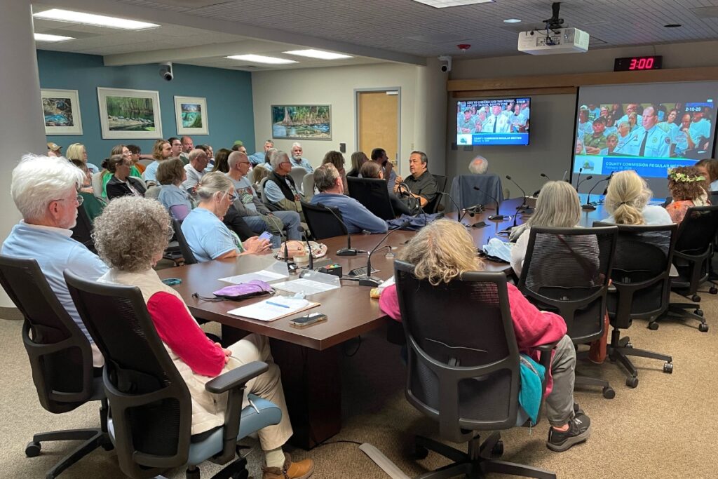 Community members gathered into an overflow room to watch the Alachua County meeting on the WildFlowers Music Park temporary use permit.