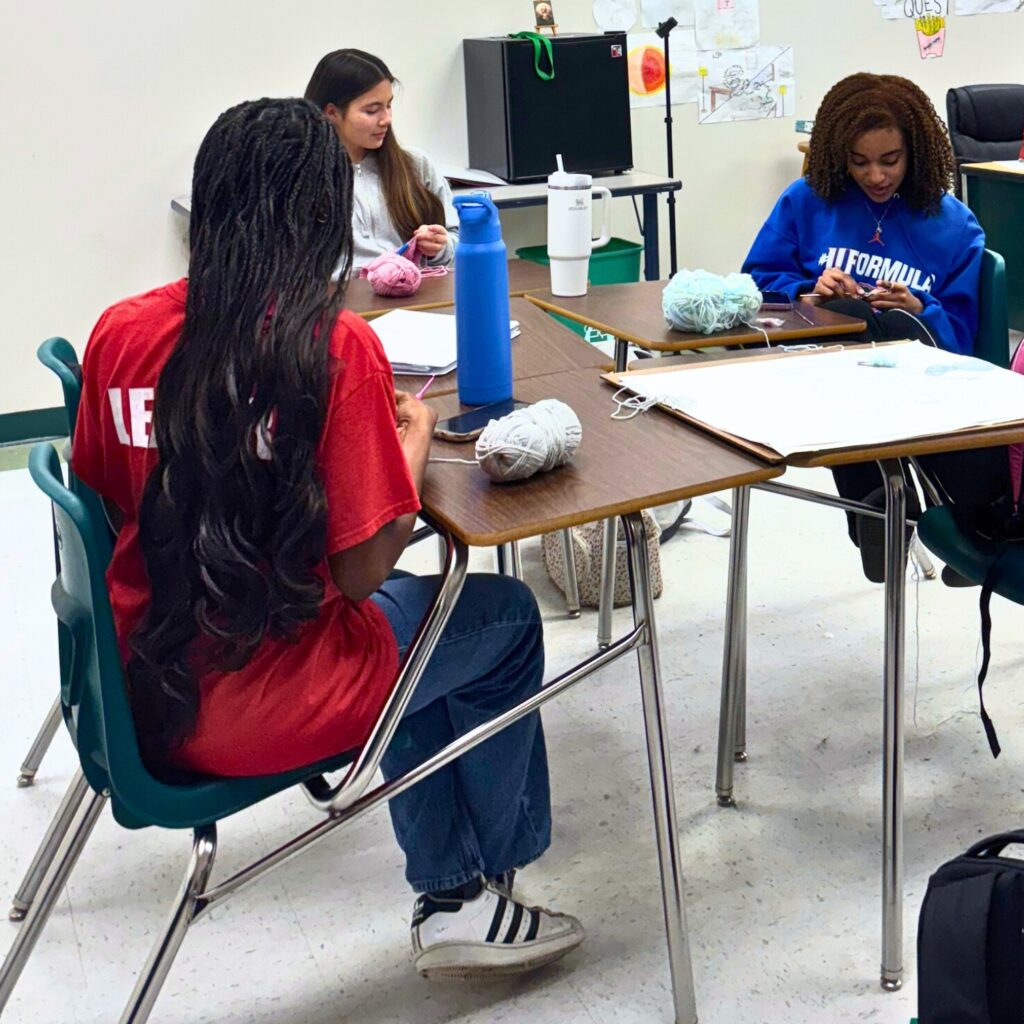 Eastside High School Crochet and Charity Club members working on a project in one of the club's meetings. Courtesy of Eastside Crochet and Charity Club