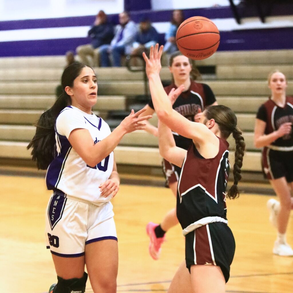 Gainesville's Catalina Giraldo Vergara (20) with a no-look pass against Chiles (Tallahassee) in the Class 5A-District 2 Semifinals. Photo by C.J. Gish
