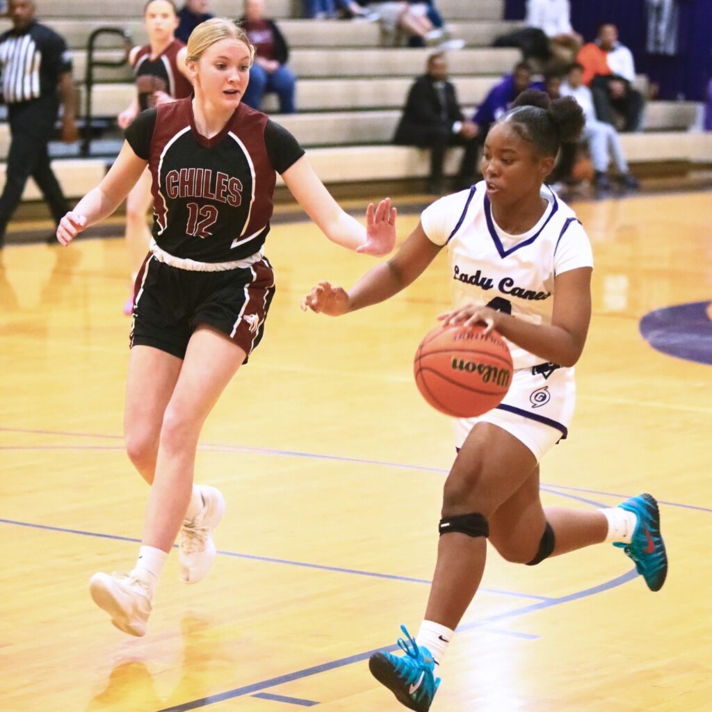 Gainesville's Lady Taylor (4) drives to the basket against Chiles (Tallahassee) in the Class 5A-District 2 Semifinals. Photo by C.J. Gish